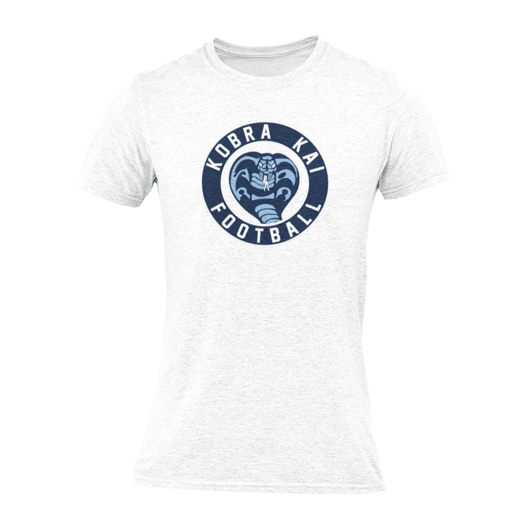 A white short-sleeve crewneck t-shirt with a navy blue circular graphic on the chest featuring a snake head and the text 'KOBRA KAI FOOTBALL'.