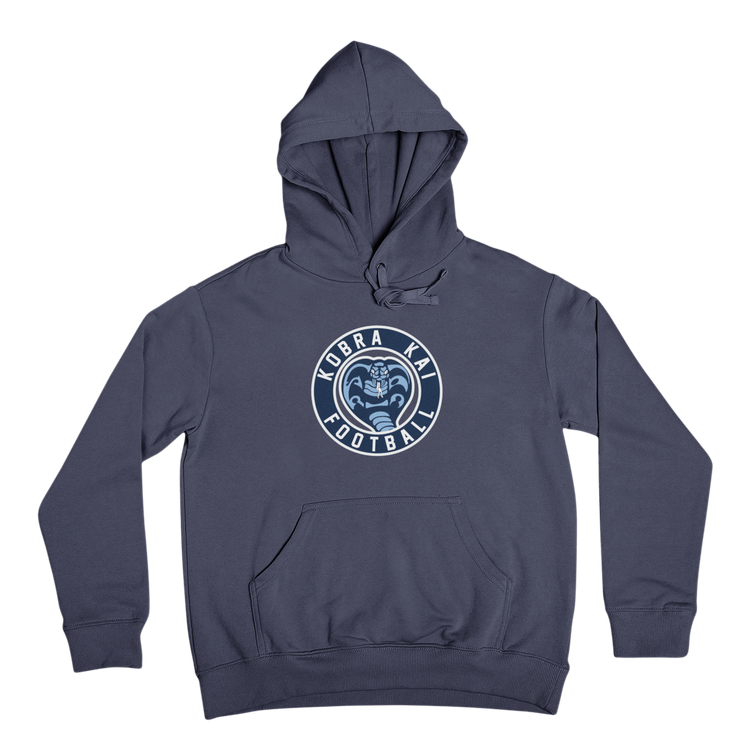 A navy blue pullover hoodie with a circular 'KOBRA KAI FOOTBALL' logo printed on the center chest.
